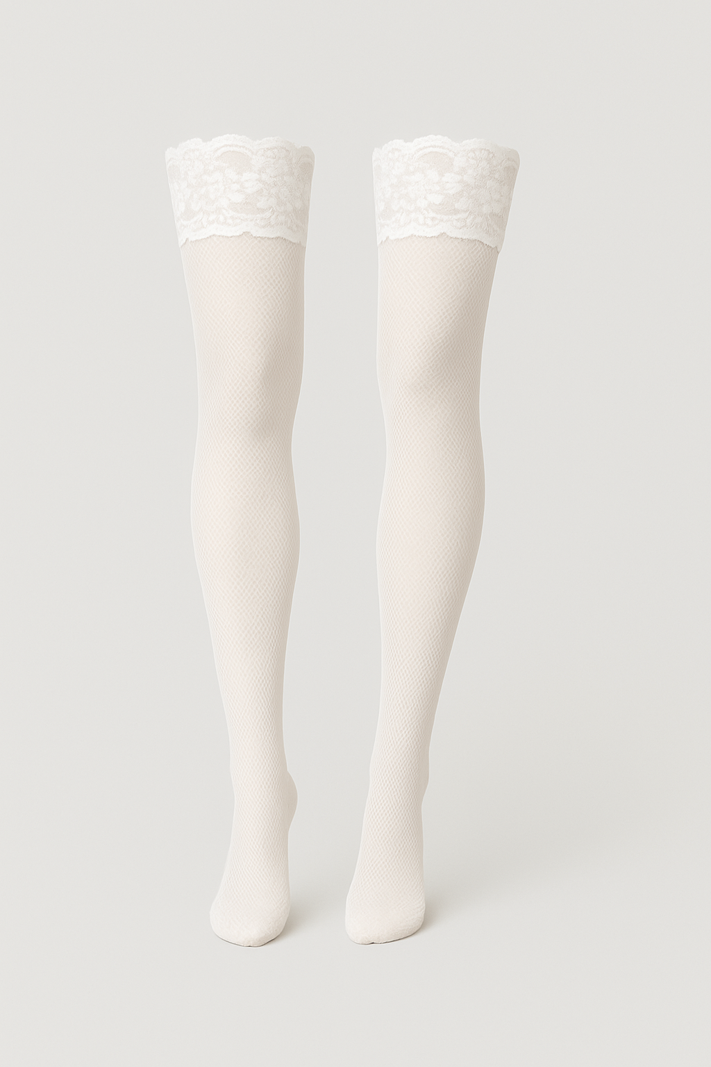 White knee-high socks on a light gray background