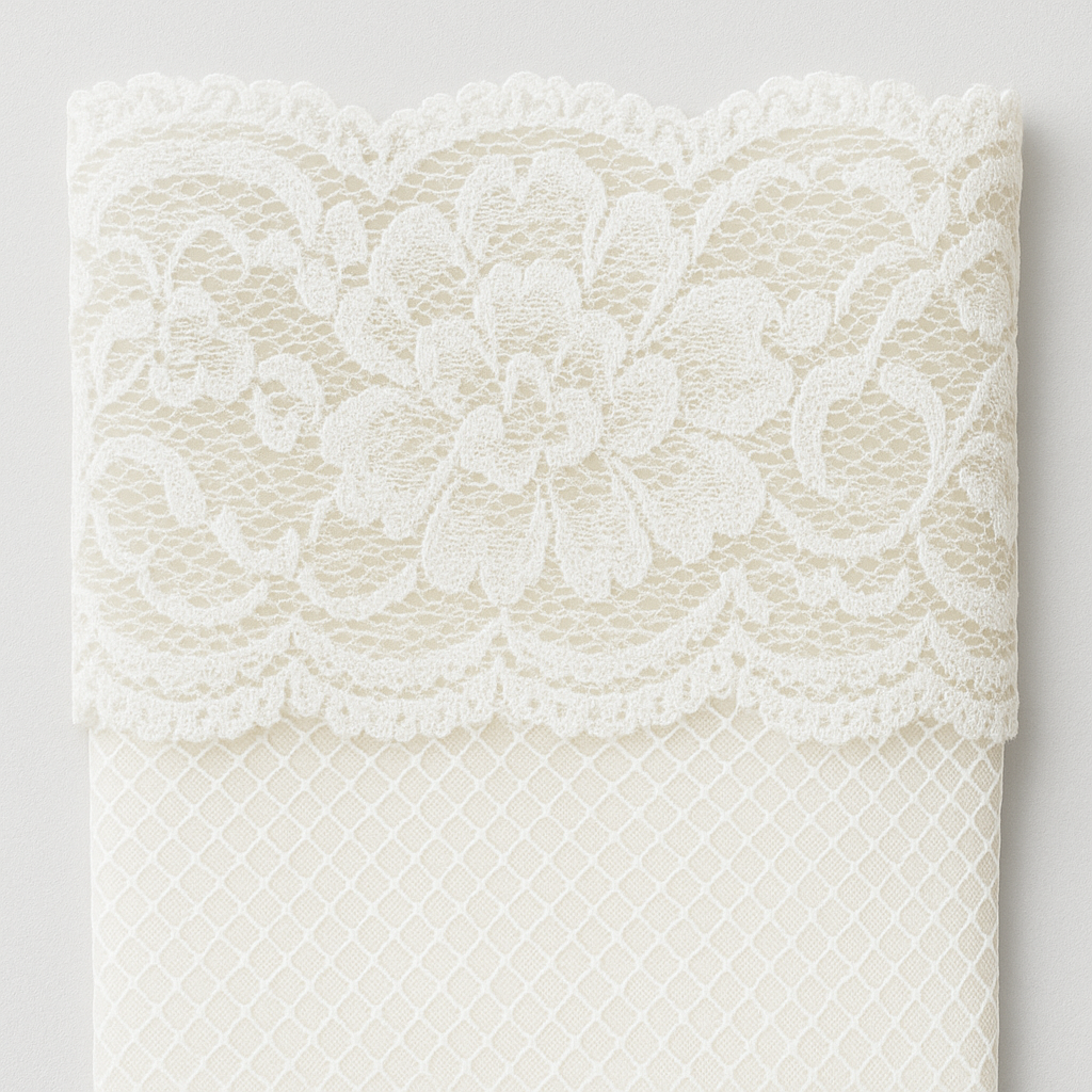 Close-up of a white lace fabric on a light gray background