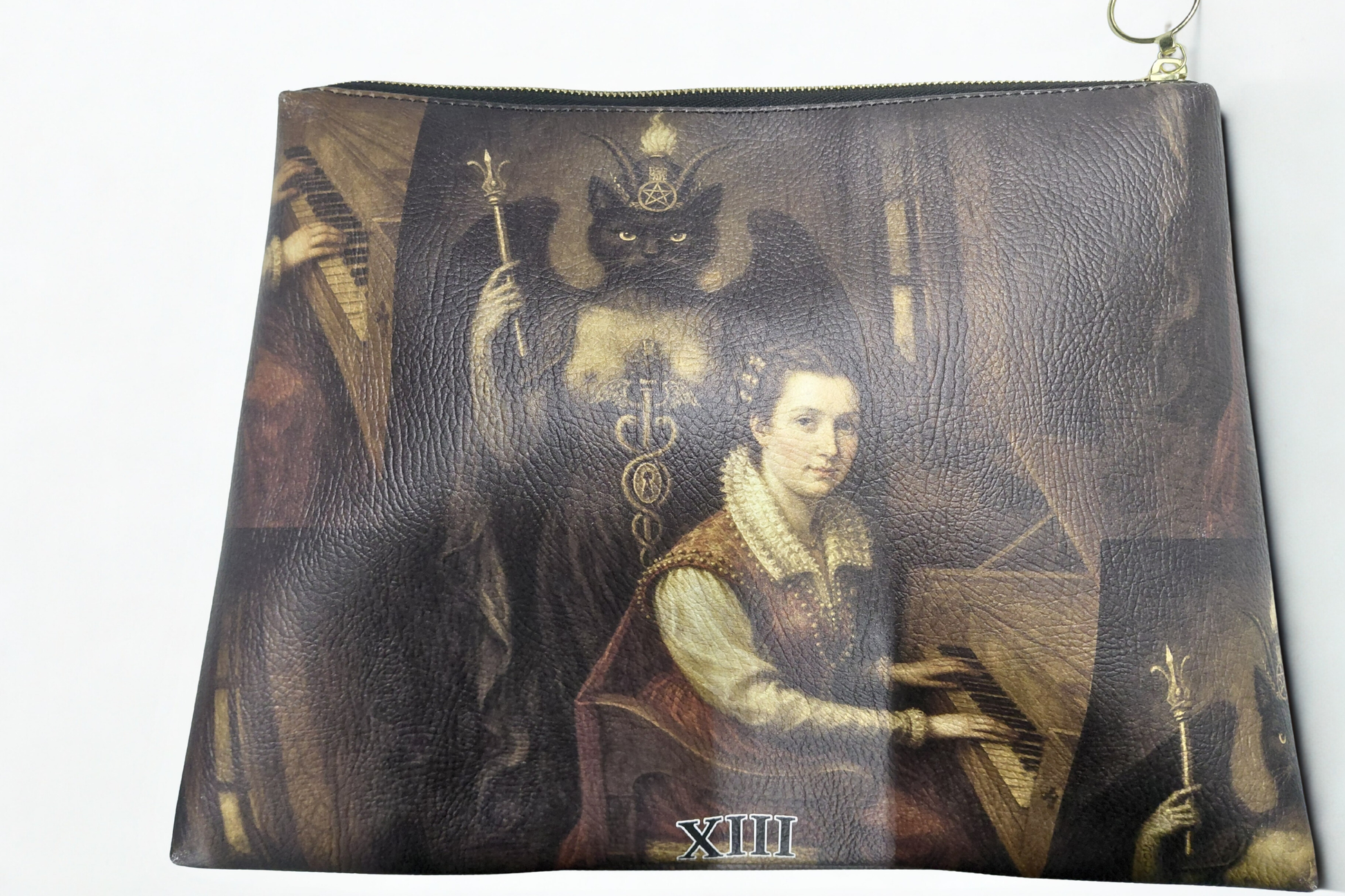 Pouch with a design of a woman playing a piano and a cat, inspired by classical art.