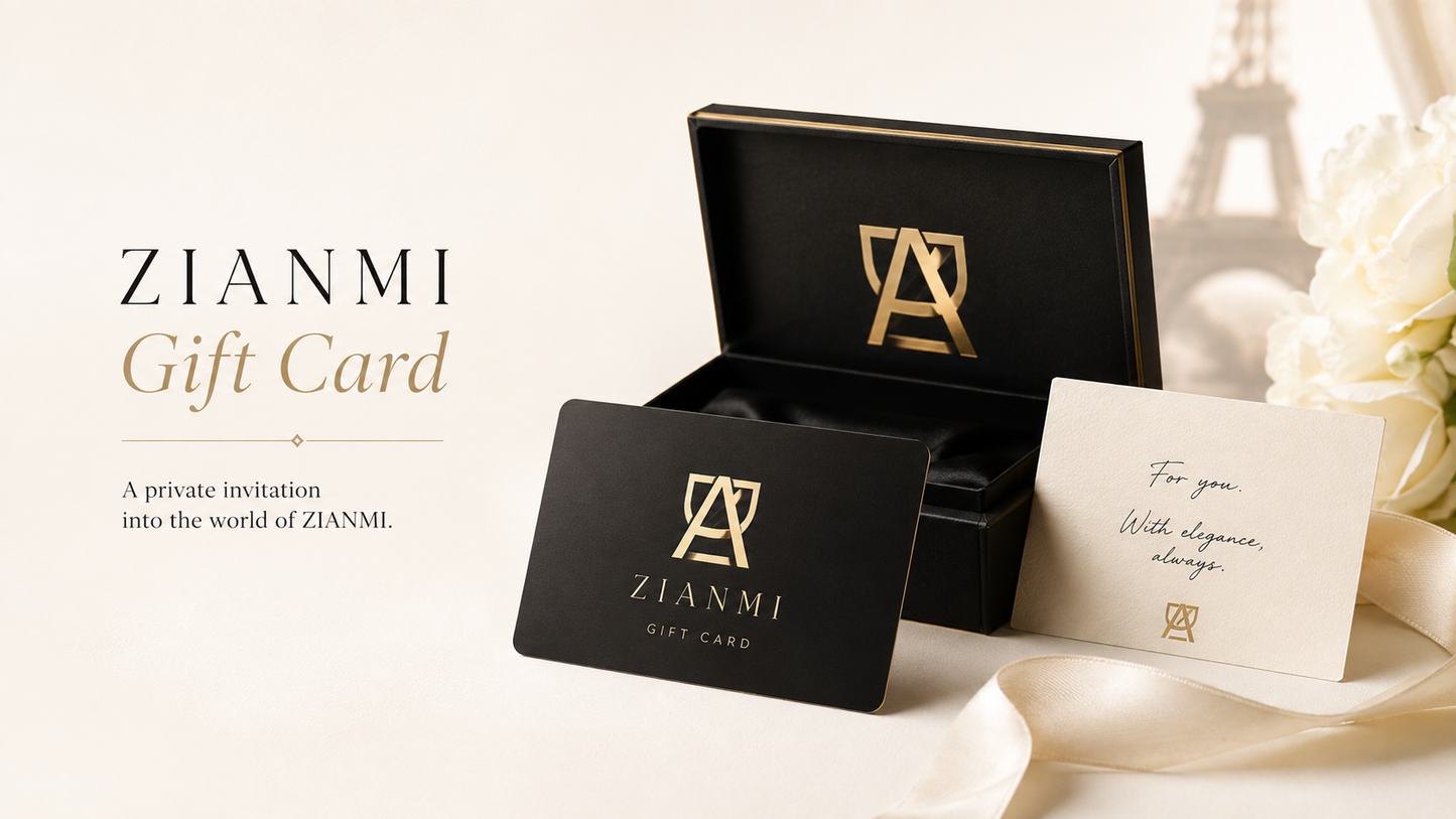 ZIANMI gift card set featuring a black gift card with gold logo, an open black presentation box with gold trim, and a cream invitation card with elegant script, styled on a light beige background with soft white flowers.